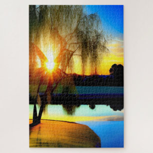 Willow tree at sunset by the pond jigsaw puzzle