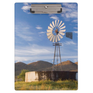 Windmill And Dam In The Karoo At Sunrise Clipboard
