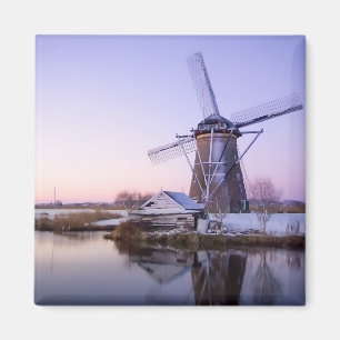 Windmill during sunrise, Holland in winter magnet
