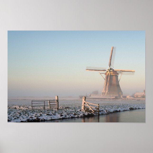 Windmill in the snow at sunrise poster print (Front)