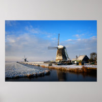 Windmill in the snow in a dutch winter landscape