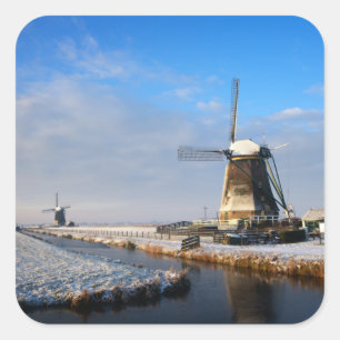 Windmill in the snow in a dutch winter landscape square sticker