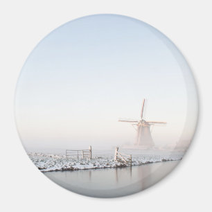 Windmill in the snow in winter round magnet