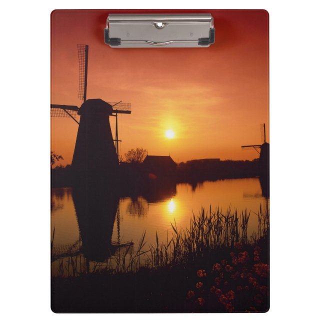 Windmills at sunset, Kinderdijk, Netherlands Clipboard (Front)