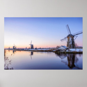 Windmills during a sunrise in Holland poster