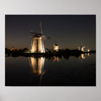 Windmills illuminated at night poster print