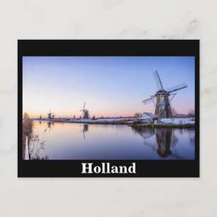 Windmills in winter during a sunrise in Holland Postcard