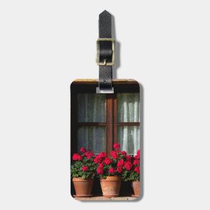 Window flower pots in village luggage tag