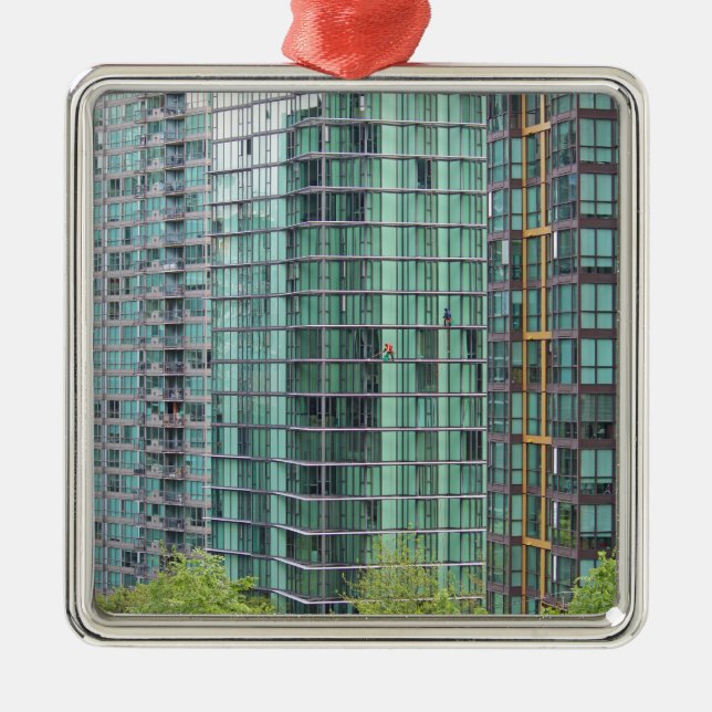 Window washers on downtown high rise building metal tree decoration (Front)