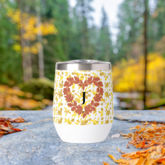 Wine glass crowns its bed of leaves with autumn