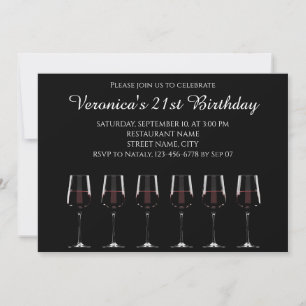 Wine glasses with red wine on black invitation