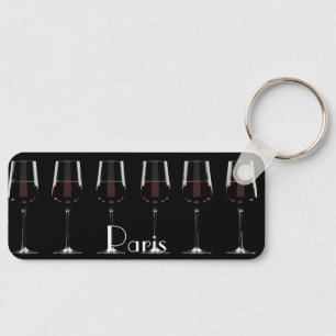 Wine glasses with red wine on black key ring