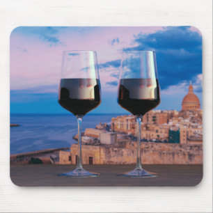 Wine glasses with view of sunset over Valletta Mouse Pad