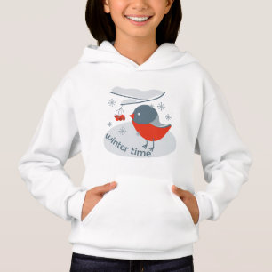 Winter bullfinch bird and red rowan berries