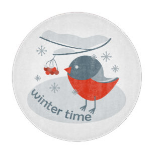 Winter bullfinch bird and red rowan berries cutting board