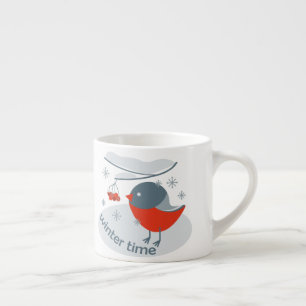 Winter bullfinch bird and red rowan berries   espresso cup