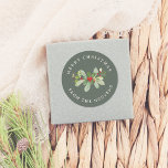 Winter Foliage Green Merry Christmas & Family Name Classic Round Sticker<br><div class="desc">This custom Christmas sticker features a festive green background. In the middle of the design there is a hand-painted botanical arrangement, with lush green leaves and red winter berries. The text forms a circle around the outside of the foliage. At the top of the sticker, "Merry Christmas" is written in...</div>