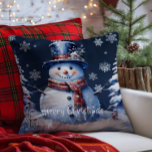 Winter Forest Snowman Christmas | Blue<br><div class="desc">Bring joy and whimsy to your seasonal decor with this charming Blue Winter Forest Holiday Throw Pillow. Featuring a smiling snowman dressed in a classic top hat and cosy scarf, the design captures the magic of a wintry scene with softly falling snow and delicate white snowflakes. Nestled among frosted trees,...</div>