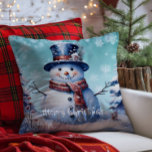 Winter Forest Snowman Christmas | Teal<br><div class="desc">Bring joy and whimsy to your seasonal decor with this charming Teal Winter Forest Holiday Throw Pillow. Featuring a smiling snowman dressed in a classic top hat and cosy scarf, the design captures the magic of a wintry scene with softly falling snow and delicate white snowflakes. Nestled among frosted trees,...</div>