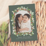 Winter Garden | Greenery Arch Christmas 1 Photo Holiday Card<br><div class="desc">Celebrate the holiday season with our elegant "Winter Garden" Christmas photo cards. A festive green card, featuring a single arch photo framed by hand-painted watercolor greenery, this design is a modern take on a traditional theme. The watercolor floral arrangement includes red winter berries, holly, pine, mistletoe foliage, and pampas grass...</div>