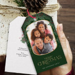 Winter Greenery Mistletoe Rounded Photo Christmas Gift Tags<br><div class="desc">This delightful Christmas gift tag showcases a vertical photo within a modern rounded frame,  accented with a mistletoe border. This dark green gift tag offers space for your favourite picture. Custom text,  on the backside,  allows you to add your own personal message,  or use the one shown.</div>