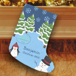 Winter Holiday Penguin and Snowman Christmas Small Christmas Stocking<br><div class="desc">Celebrate the festive Christmas season with this custom holiday stocking. Stocking features a penguin in a cozy winter hat, a smiling happy snowman, trees covered in snow, white falling snowflakes, and an icy blue pond. Customize with your first name and the year. This cozy stocking will be treasured for many...</div>
