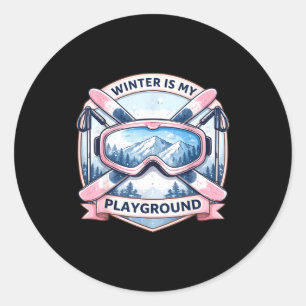 Winter is playground ski lover woman skiing girl classic round sticker