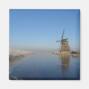 Winter landscape with windmill and ice magnet