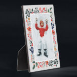 Winter Photo Plaque<br><div class="desc">Tabletop built-in photo easel features your favourite photo surrounded by snow and winter flowers - poinsettias, berries and leaves - on ANY COLOR BACKGROUND (we show blue.) Change the YEAR (in the lower right corner) or it can be deleted. Great as a gift or to display your favourite photo in...</div>