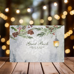 Winter Rustic Pine Trees Lantern Botanical Wedding Guest Book<br><div class="desc">Capture the cosy ambiance of your winter wedding with this enchanting guest book. Adorned with a rustic watercolor design featuring majestic pine trees, a warm lantern glow, and delicate botanical accents, this guest book provides a charming space for loved ones to share their well wishes and heartfelt messages. A treasured...</div>