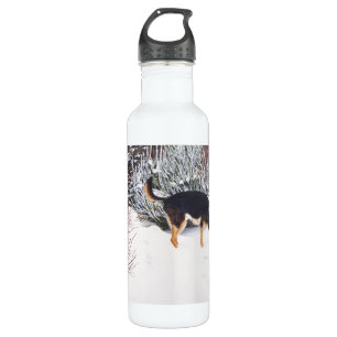 Winter snow scene with cute black and tan dog 710 ml water bottle