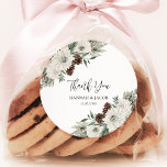 Winter Wedding Pine Favour Thank You Classic Round Sticker<br><div class="desc">Add a touch of winter magic to your special day with our Elegant Pine Cone & White Floral round stickers, perfect for thank you favours. With their chic greenery design, these stickers effortlessly blend nature's beauty with classic elegance. Seal your love with this charming detail, making your wedding favours as...</div>