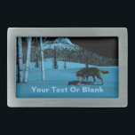 Winter Wolf - Tapetum Lucidum Belt Buckle<br><div class="desc">A wolf walking on hard-crusted snow at night; a tree-covered peak in the background. Moonlight reflects off snow and pale bark of birch trees. The wolf's eyes also glow with reflected moonlight. Add your own text. The reflective quality of many animals eyes is due to the tapetum lucidum (Latin: "bright...</div>