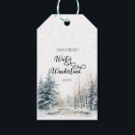 Winter Wonderland Christmas Baby Shower Gift Tags<br><div class="desc">This "Winter Wonderland" baby shower gidft tag with a snowy forestscape as the background exudes a magical and enchanting atmosphere, perfectly suited for a winter-themed celebration.The backdrop of the ornament is a breathtaking snowy forestscape. It depicts a serene winter wonderland, with tall pine trees laden with glistening snowflakes. The trees...</div>
