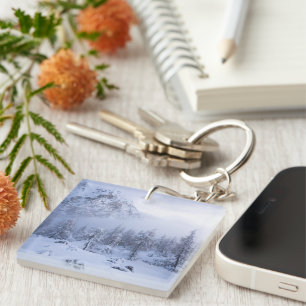 Winter wonderland, fog, spruce forest and mountain key ring