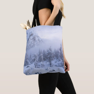 Winter wonderland, fog, spruce forest and mountain tote bag
