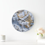 Winter Wonderland Reindeer Charm Large Clock<br><div class="desc">A captivating Christmas clock features a beautifully carved white deer standing amidst a serene winter landscape. Frosty mountains and golden trees enhance the festive spirit,  creating a perfect blend of nature and holiday charm.</div>