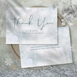 Winter Wonderland Snowflakes Wedding Thank You Card<br><div class="desc">Gentle snowflakes fall across your wedding thank you message set on a magical winter background. This chic wedding thank you card can be personalised with your special thank you message and names. You can personalise with your own thank you message on the reverse or delete the text if you prefer...</div>