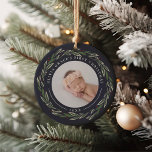Winter Wreath | Baby's First Christmas Photo Ceramic Tree Decoration<br><div class="desc">A perfect gift for new parents, this elegant Christmas ornament features front and back photos encircled by a wreath of dark green leaves and red berries. "[Name's] first Christmas" curves over the top of each photo, with the year beneath. Customise with a favourite photo on each side to create a...</div>