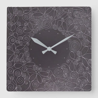 wire ornaments on black background square wall clock