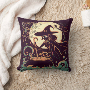 Witch creating potions under a glowing moon cushion