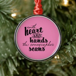 With Heart and Hands the Sonographer Scans Metal Tree Decoration