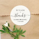 With Love And Thanks Cream Wedding Thank You Classic Round Sticker<br><div class="desc">Chic light cream thank you sticker for your wedding reception favours and thank you cards that features "With Love   Thanks" in simple modern typography and an elegant script with swashes,  your first names joined together with a heart and your wedding date.</div>