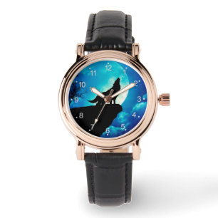 Wolf in silhouette howling to the full moon watch