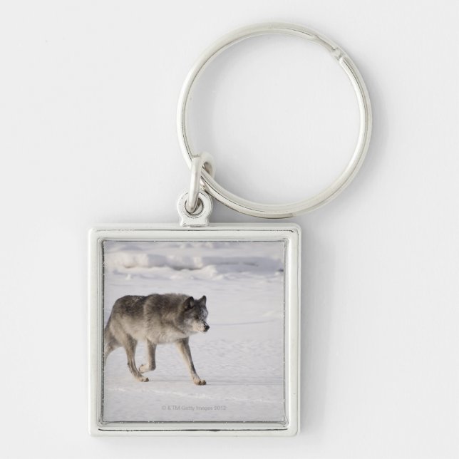 Wolf running in the snow key ring (Front)