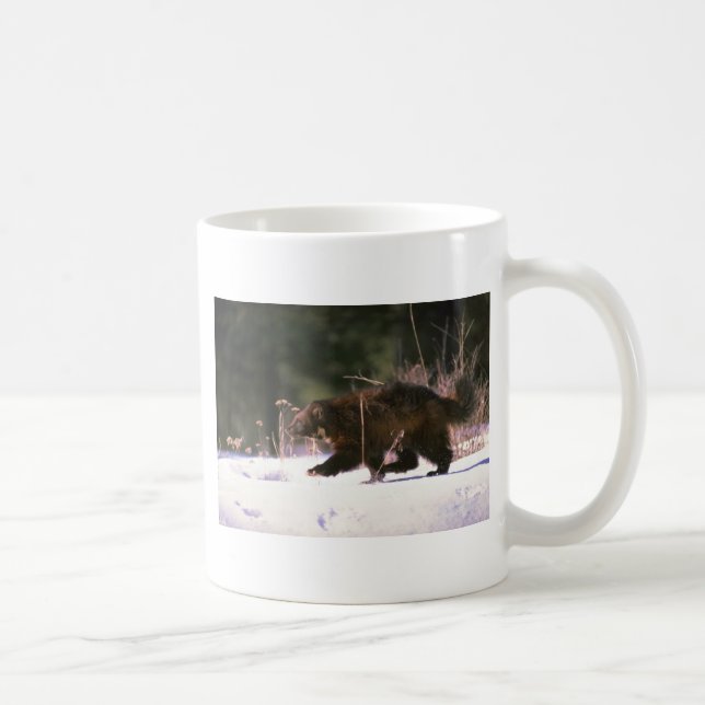 Wolverine running through snow coffee mug (Right)