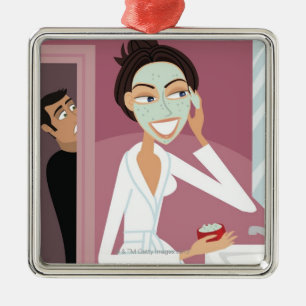Woman applying facial mask metal tree decoration