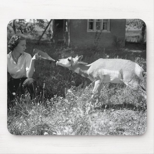 Woman bottle feeding an antelope. mouse pad (Front)