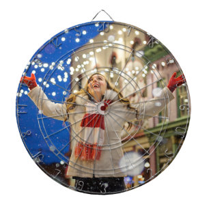 Woman Celebrates Christmas With Arms in the Air Dartboard