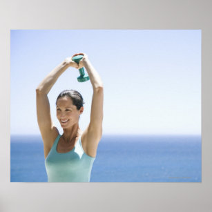 woman excercising with weights on her roof poster